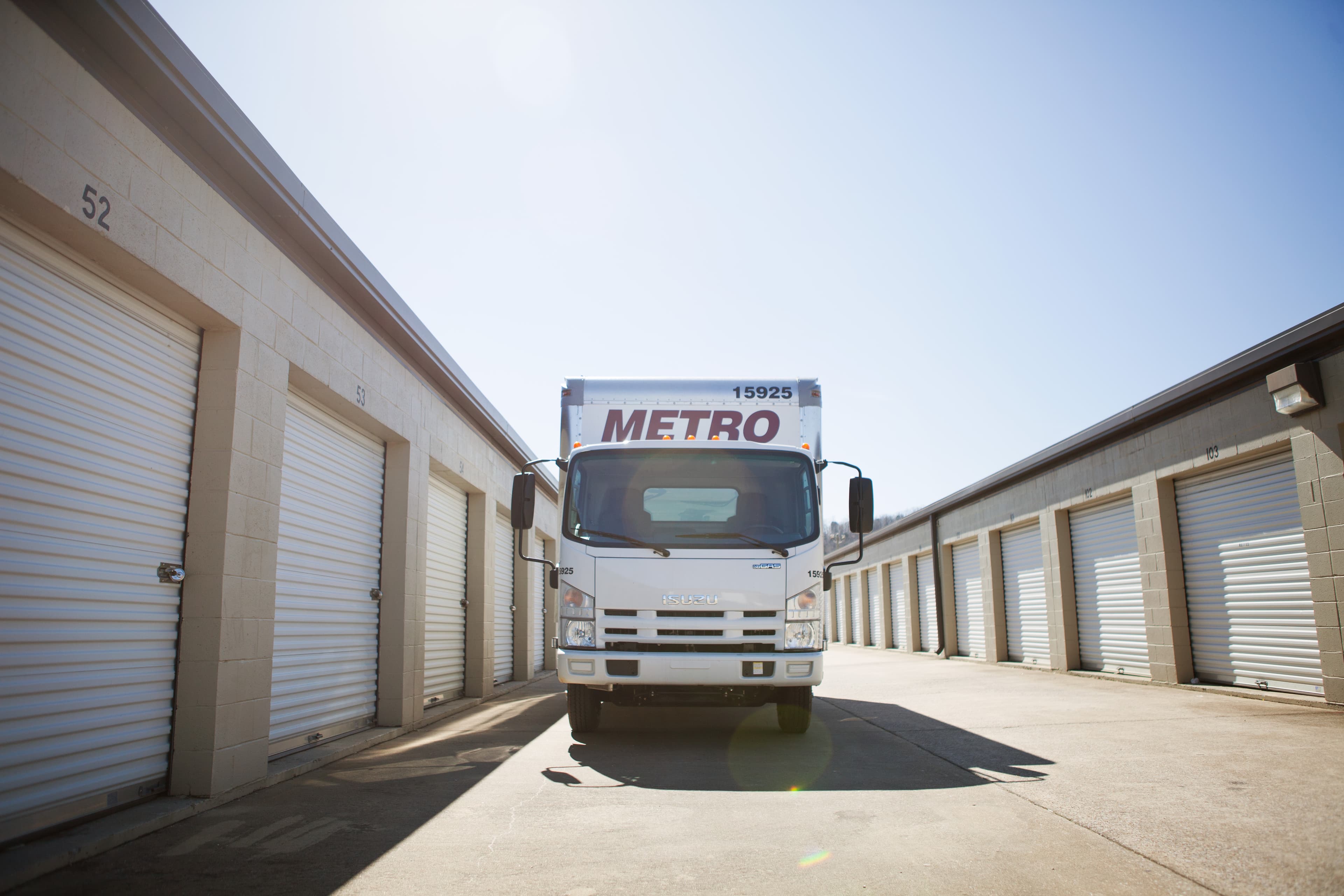 Metro truck parked near a self-storage facility.