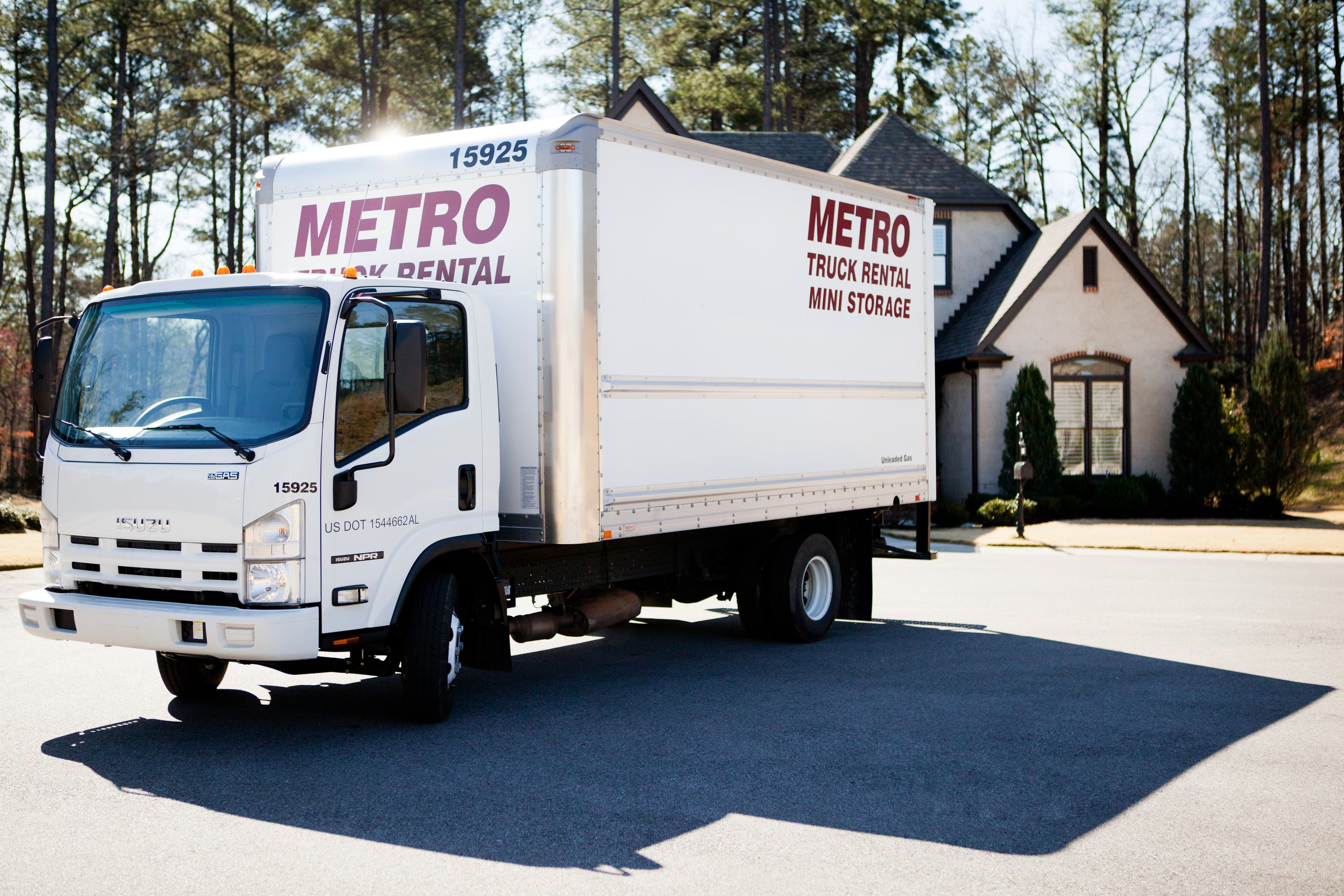 Metro truck parked in a residential neighborhood.