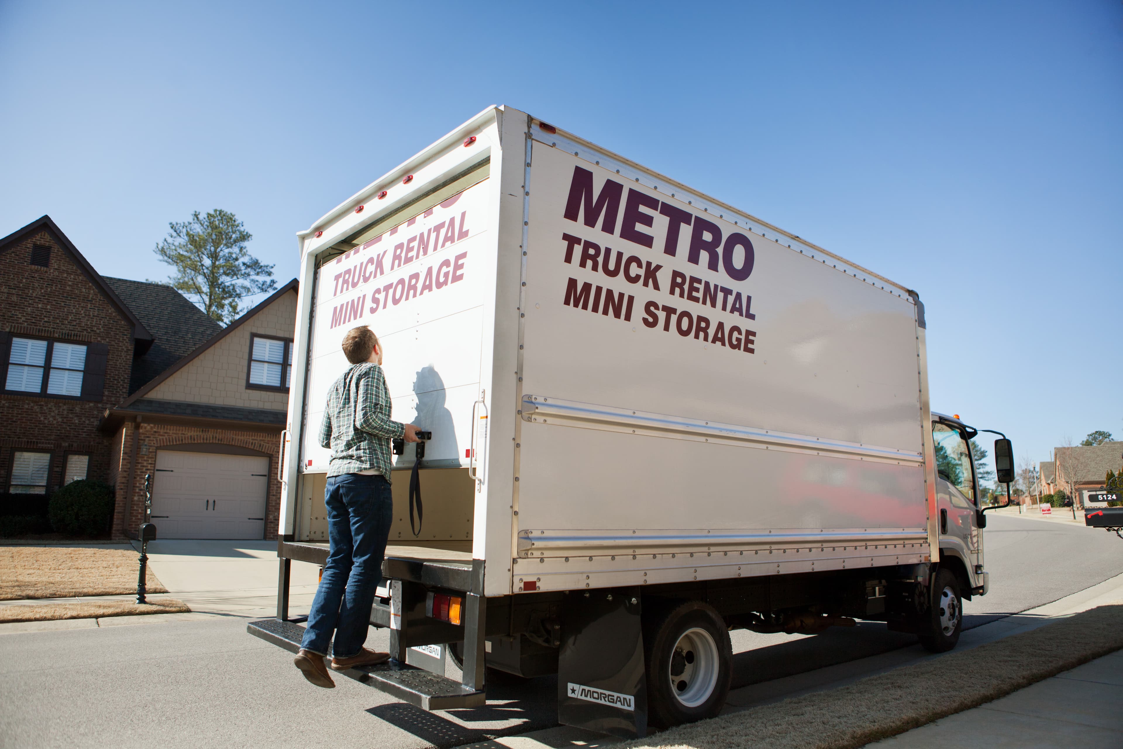 Metro truck being unloaded on site.